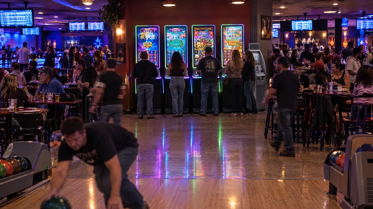 Foxfire cabinets and a payout kiosk in a bowling alley
