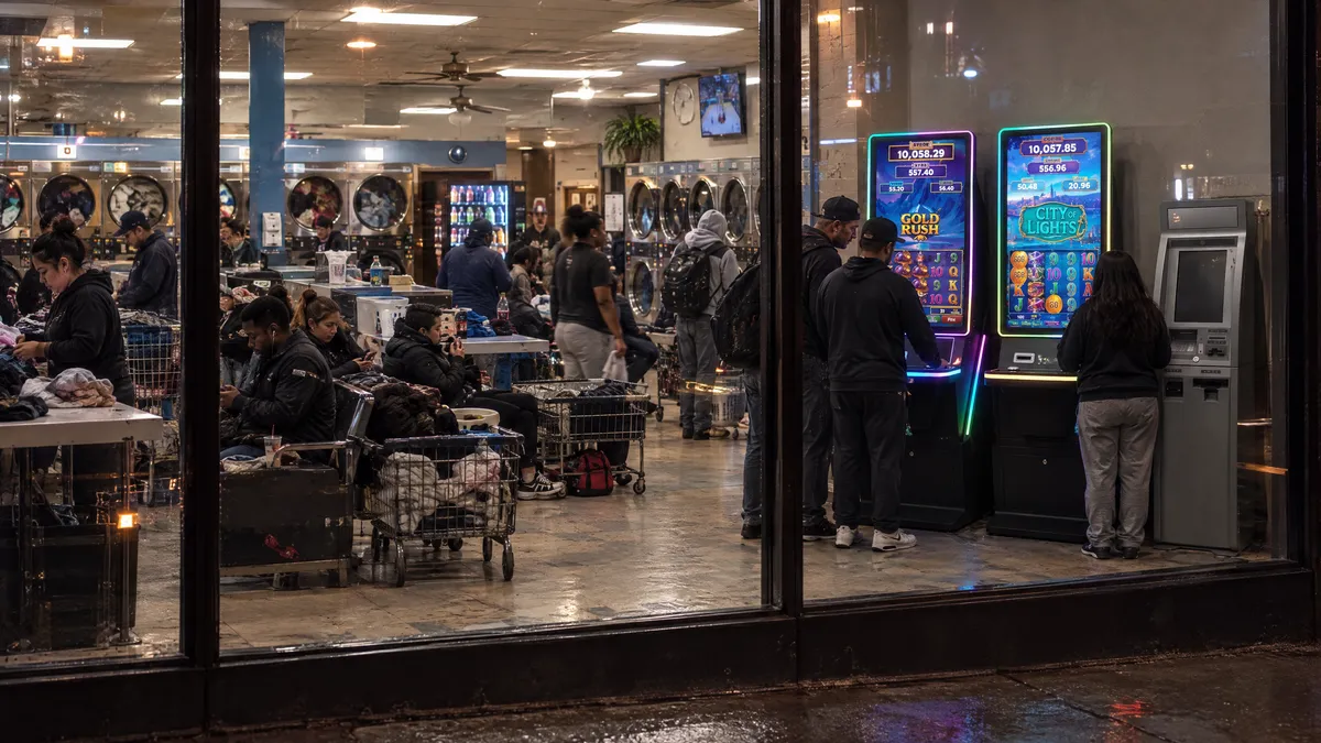 Foxfire cabinets and a payout kiosk in a laundromat